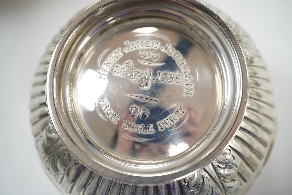 Two Victorian silver sugar bowls, a Victorian silver gilt sifter ladle and a repousse silver dish, 11.8oz. Condition - fair to good